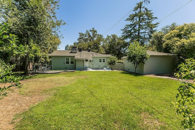 4845 Arcade Ave, Fresno, CA 93704 - rear view of house featuring a patio area and an outdoor structure