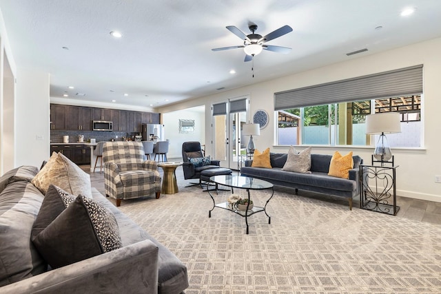 2421 N Cabrenet Pl, Hanford, CA 93230 - living area with light wood-style floors, recessed lighting, and a ceiling fan