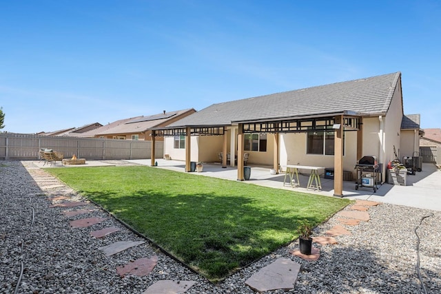 2421 N Cabrenet Pl, Hanford, CA 93230 - rear view of house with a patio area, a fenced backyard, stucco siding, and a tiled roof