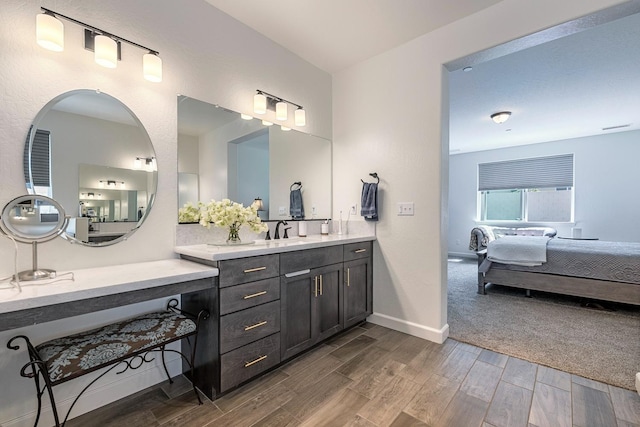 2421 N Cabrenet Pl, Hanford, CA 93230 - ensuite bathroom with vanity and wood finished floors