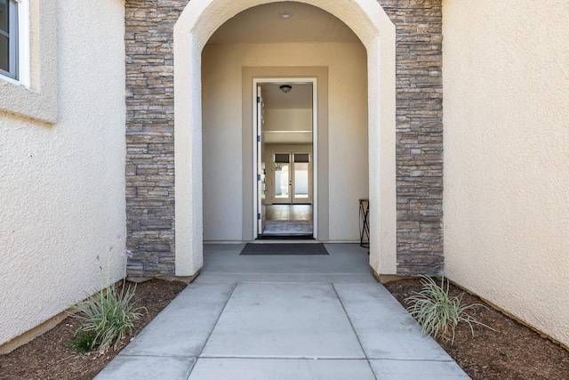 2421 N Cabrenet Pl, Hanford, CA 93230 - doorway to property featuring stone siding and stucco siding