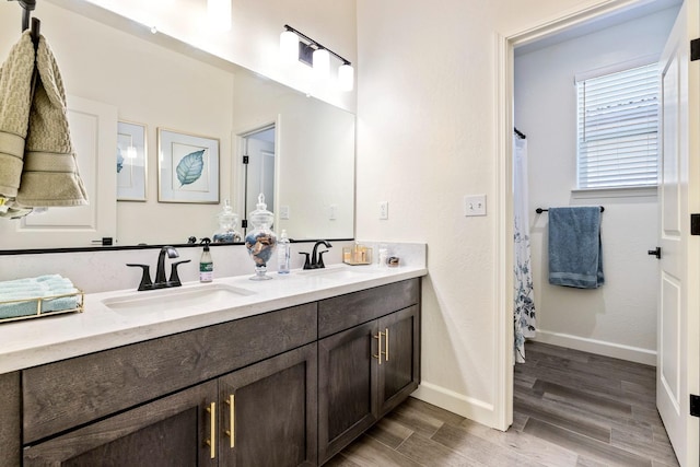 2421 N Cabrenet Pl, Hanford, CA 93230 - bathroom with double vanity and wood finished floors