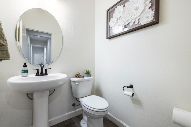 2421 N Cabrenet Pl, Hanford, CA 93230 - bathroom featuring toilet and wood finished floors