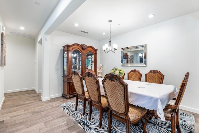 2421 N Cabrenet Pl, Hanford, CA 93230 - dining room featuring light wood-style flooring, a chandelier, and recessed lighting