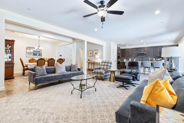 2421 N Cabrenet Pl, Hanford, CA 93230 - living area featuring a ceiling fan, light wood-style flooring, recessed lighting, and a chandelier