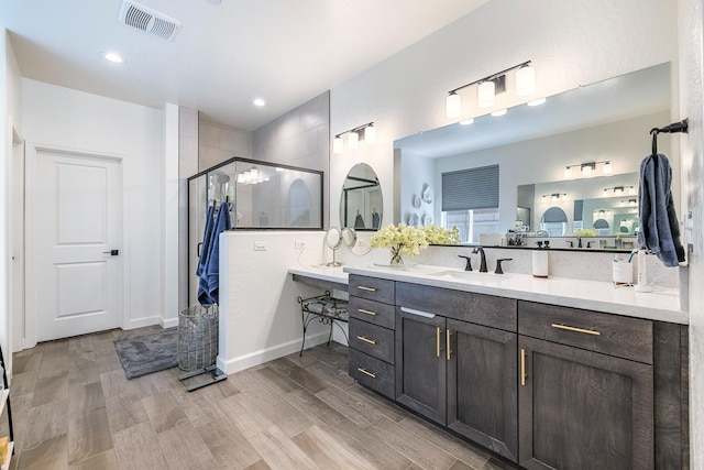 2421 N Cabrenet Pl, Hanford, CA 93230 - full bath featuring a shower stall, wood finished floors, vanity, and recessed lighting