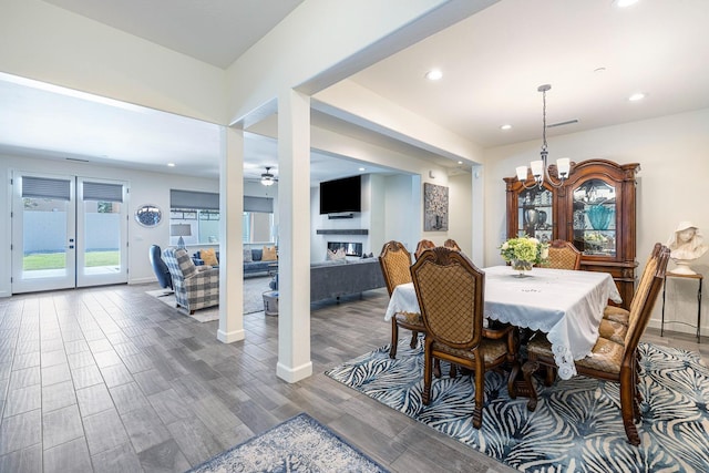 2421 N Cabrenet Pl, Hanford, CA 93230 - dining room with a chandelier, recessed lighting, wood finished floors, a ceiling fan, and a fireplace