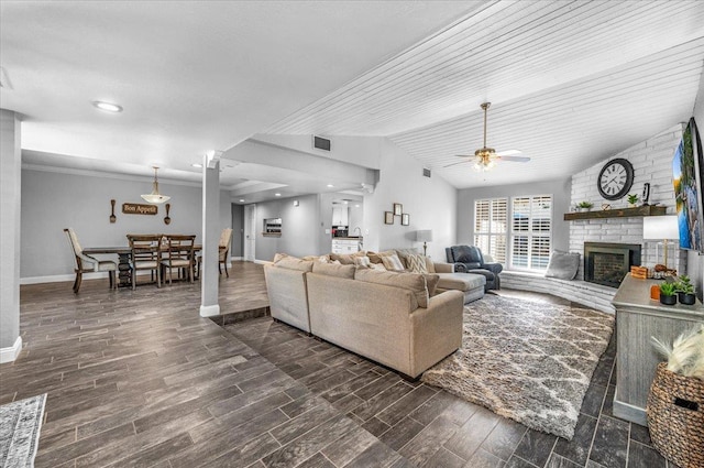 3251 W Magill Ave, Fresno, CA 93711 - living area featuring a ceiling fan, a fireplace, dark wood-style flooring, lofted ceiling, and recessed lighting