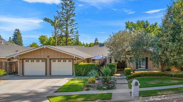 3251 W Magill Ave, Fresno, CA 93711 - view of front facade with an attached garage, concrete driveway, and board and batten siding