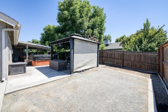 365 Stanford Ave, Clovis, CA 93611 - fenced backyard featuring a hot tub and a patio area