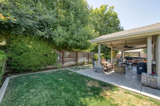 365 Stanford Ave, Clovis, CA 93611 - fenced backyard featuring an outdoor living space with a fire pit, a ceiling fan, and a patio