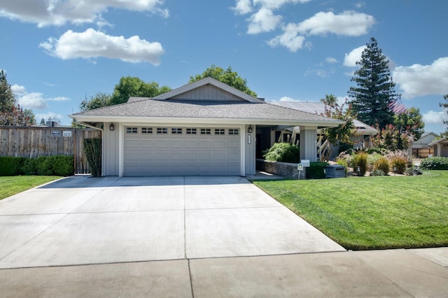 365 Stanford Ave, Clovis, CA 93611 - ranch-style home featuring board and batten siding, a garage, and concrete driveway