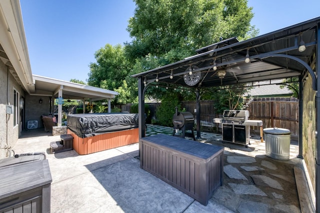365 Stanford Ave, Clovis, CA 93611 - fenced backyard with a hot tub, a gazebo, a patio, and grilling area