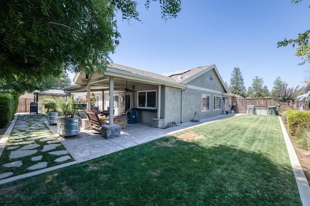 365 Stanford Ave, Clovis, CA 93611 - back of property with a ceiling fan, a gazebo, a fenced backyard, and stucco siding