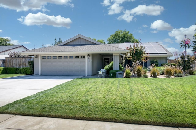 365 Stanford Ave, Clovis, CA 93611 - ranch-style house with a garage, roof mounted solar panels, and concrete driveway