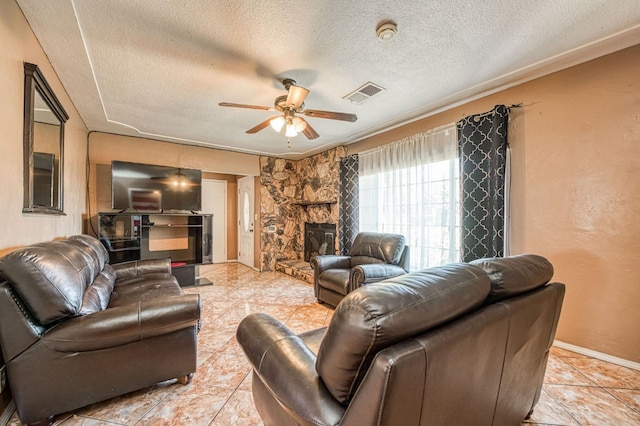 1830 Valeria St, Dos Palos, CA 93620 - living room featuring ceiling fan, a textured ceiling, and light tile patterned flooring