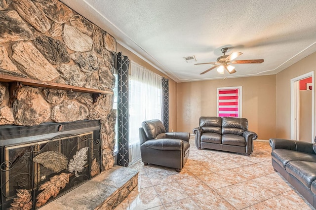1830 Valeria St, Dos Palos, CA 93620 - living room with a textured ceiling, a ceiling fan, and light tile patterned floors