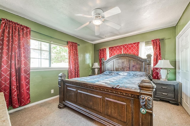 1830 Valeria St, Dos Palos, CA 93620 - bedroom featuring light colored carpet, a textured ceiling, and a ceiling fan