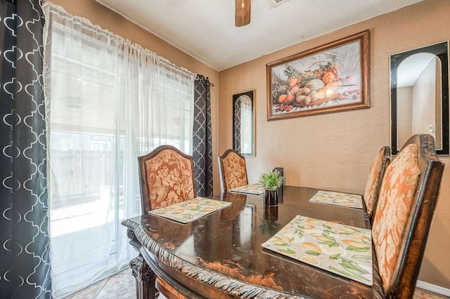 1830 Valeria St, Dos Palos, CA 93620 - dining area with healthy amount of natural light, a textured wall, and a ceiling fan