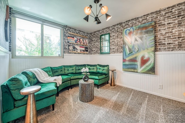 5180 N Wishon Ave Unit 103, Fresno, CA 93704 - carpeted living area featuring a wainscoted wall and a chandelier