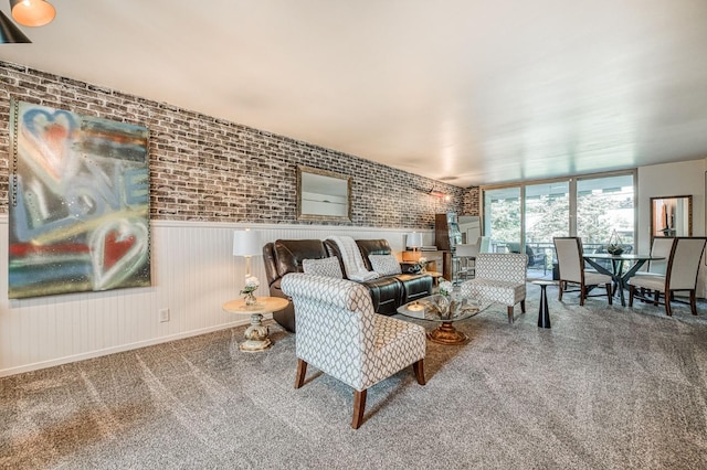 5180 N Wishon Ave Unit 103, Fresno, CA 93704 - carpeted living area featuring brick wall