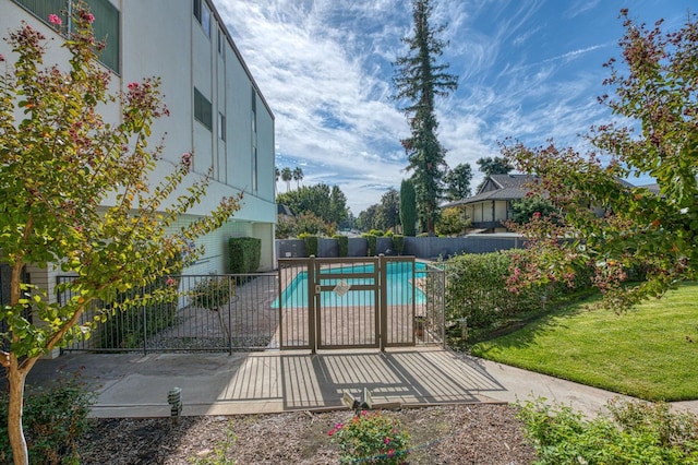 5180 N Wishon Ave Unit 103, Fresno, CA 93704 - view of swimming pool with a gate