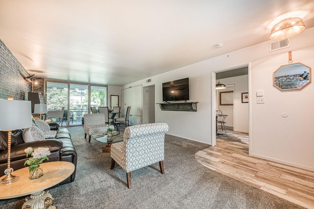 5180 N Wishon Ave Unit 103, Fresno, CA 93704 - living room with floor to ceiling windows and wood finished floors