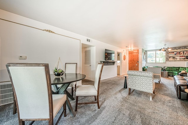 5180 N Wishon Ave Unit 103, Fresno, CA 93704 - living room with carpet floors and a chandelier