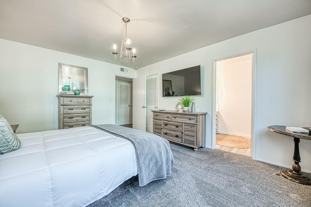 5180 N Wishon Ave Unit 103, Fresno, CA 93704 - bedroom featuring carpet, a chandelier, and ensuite bathroom