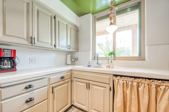 5180 N Wishon Ave Unit 103, Fresno, CA 93704 - kitchen with backsplash and tile countertops