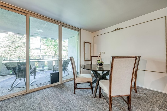 5180 N Wishon Ave Unit 103, Fresno, CA 93704 - dining room with carpet and floor to ceiling windows
