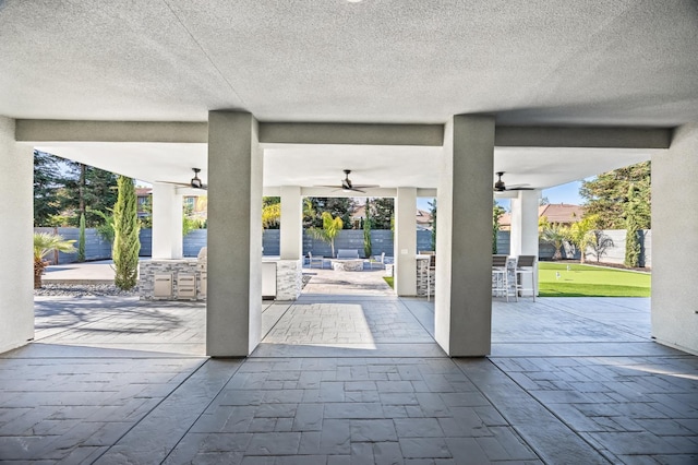 7160 W Dovewood Ln, Fresno, CA 93723 - view of patio featuring a ceiling fan and a putting area