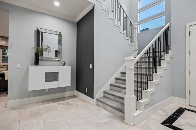 7160 W Dovewood Ln, Fresno, CA 93723 - foyer with stairs, ornamental molding, plenty of natural light, and recessed lighting