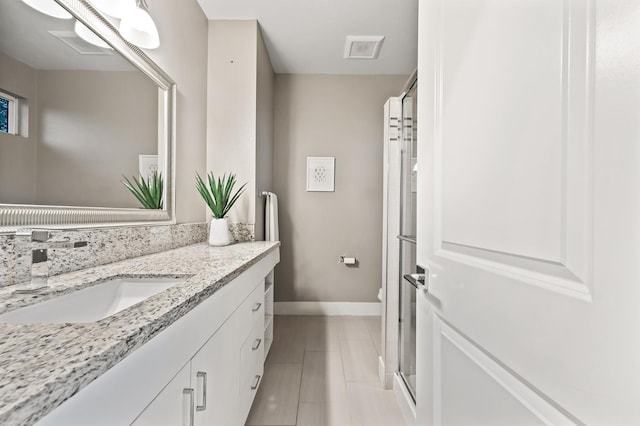 7160 W Dovewood Ln, Fresno, CA 93723 - full bath with vanity, an enclosed shower, and tile patterned flooring
