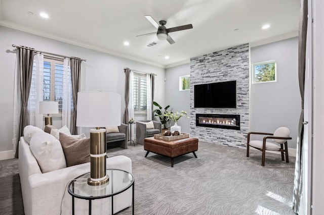 7160 W Dovewood Ln, Fresno, CA 93723 - living room featuring healthy amount of natural light, carpet floors, a ceiling fan, crown molding, and a large fireplace