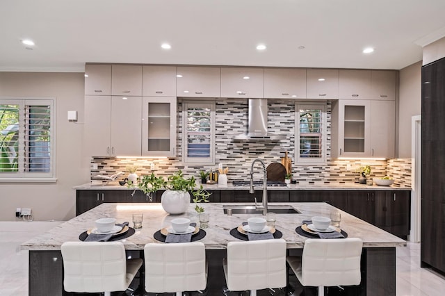 7160 W Dovewood Ln, Fresno, CA 93723 - kitchen with decorative backsplash, light stone counters, glass insert cabinets, recessed lighting, and crown molding