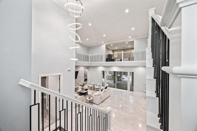 7160 W Dovewood Ln, Fresno, CA 93723 - staircase featuring recessed lighting, a towering ceiling, marble tiled flooring, and ornamental molding
