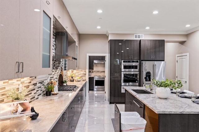 7160 W Dovewood Ln, Fresno, CA 93723 - kitchen featuring appliances with stainless steel finishes, modern cabinets, decorative backsplash, recessed lighting, and glass insert cabinets