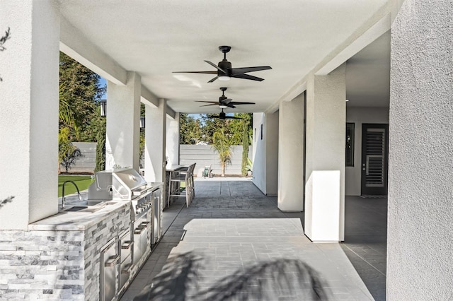 7160 W Dovewood Ln, Fresno, CA 93723 - view of patio with exterior kitchen, a ceiling fan, and beverage cooler