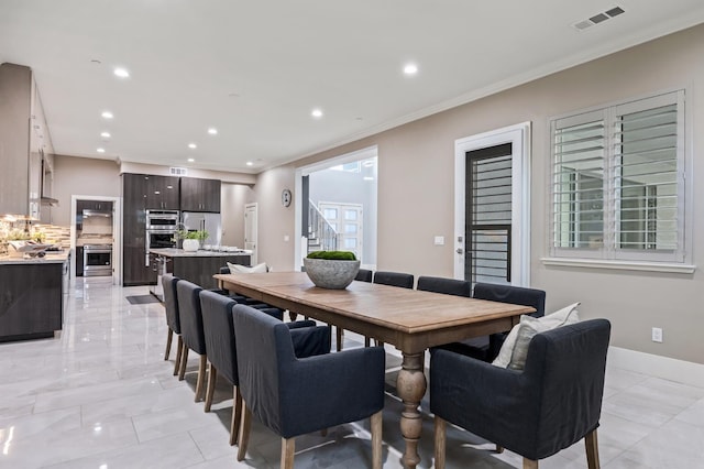 7160 W Dovewood Ln, Fresno, CA 93723 - dining area featuring recessed lighting and crown molding