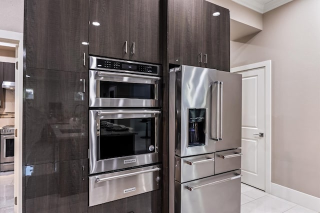 7160 W Dovewood Ln, Fresno, CA 93723 - kitchen featuring stainless steel appliances, a warming drawer, dark brown cabinetry, light tile patterned floors, and ornamental molding