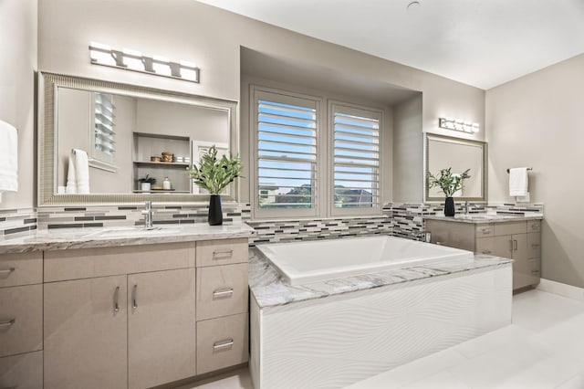 7160 W Dovewood Ln, Fresno, CA 93723 - bathroom featuring two vanities, tasteful backsplash, and a bath