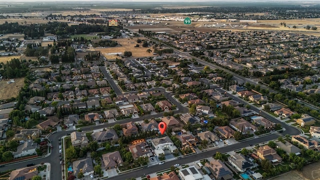 7160 W Dovewood Ln, Fresno, CA 93723 - aerial view of property's location featuring nearby suburban area