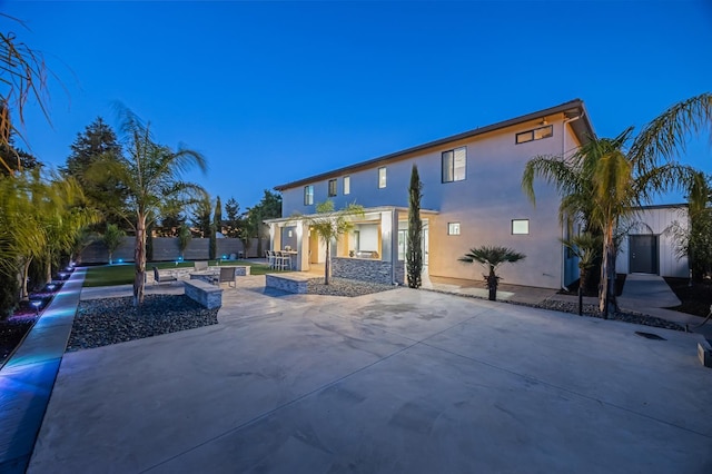 7160 W Dovewood Ln, Fresno, CA 93723 - back of house featuring stucco siding and a patio
