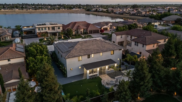 7160 W Dovewood Ln, Fresno, CA 93723 - aerial view at dusk of a residential view and a water view