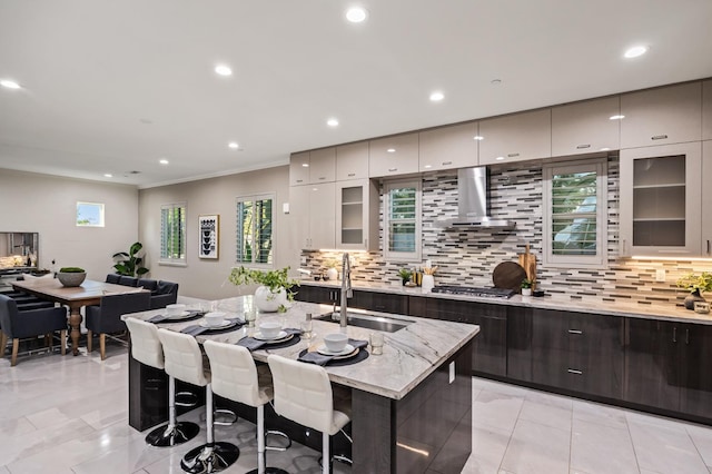 7160 W Dovewood Ln, Fresno, CA 93723 - kitchen with exhaust hood, tasteful backsplash, a breakfast bar, modern cabinets, and recessed lighting