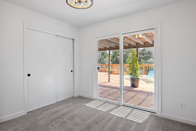 9098 San Gabriel Rd, Atascadero, CA 93422 - unfurnished bedroom featuring carpet flooring, access to exterior, a closet, and a chandelier
