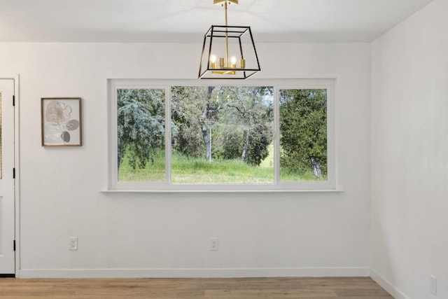 9098 San Gabriel Rd, Atascadero, CA 93422 - unfurnished dining area with a chandelier and light wood-type flooring