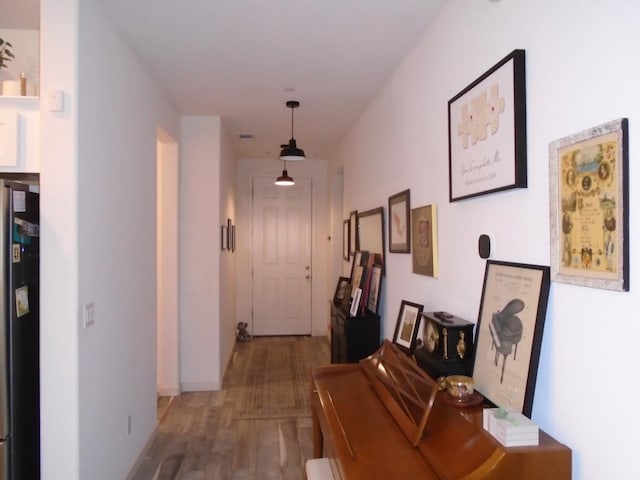 6908 E Castle Ave, Fresno, CA 93727 - corridor with wood finished floors and baseboards