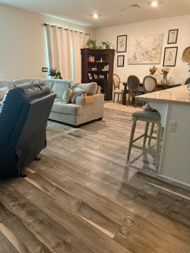 6908 E Castle Ave, Fresno, CA 93727 - living area featuring hardwood / wood-style floors